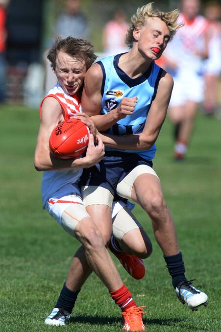 V/LINE UNDER-15 SCHOOLBOY FOOTBALL CHAMPIONSHIPS - DIV 3 - ROUND 1 - Ballarat v South West. Will McGannon (Ballarat) and Taylor Murrell (South West). PIC: KATE HEALY
