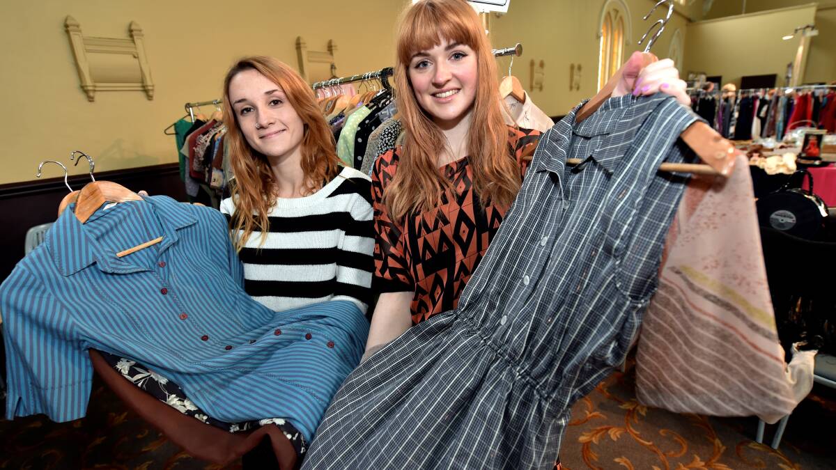 Felicity Nihill and Cassandra Cartledge check out the hundreds of vintage dresses on display at the Pop Up Frock Up fair in Ballarat. Picture: Jeremy Bannister