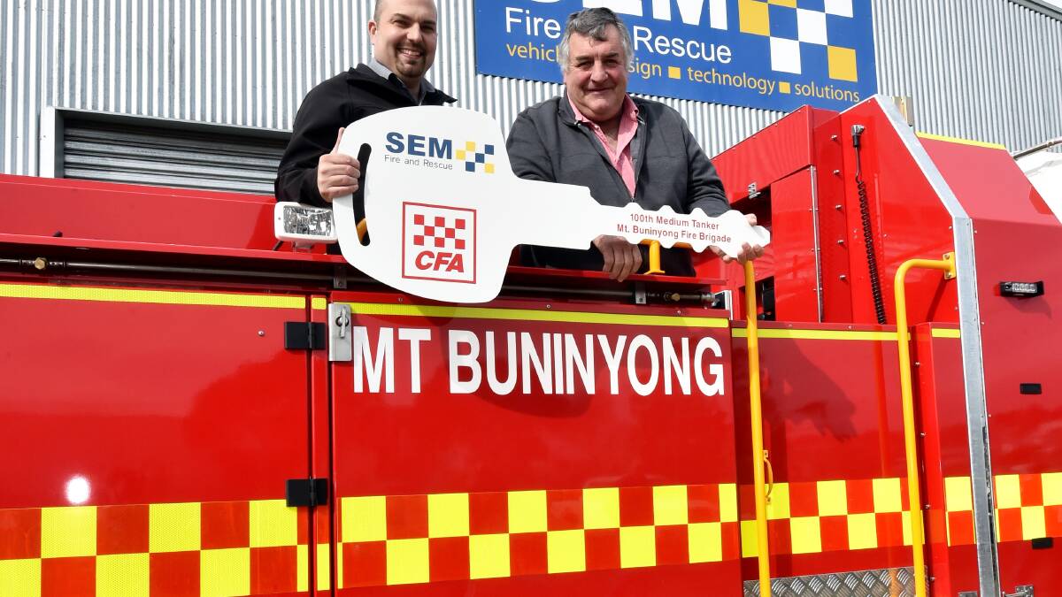 SEM product manager Jon Julian hands over the new tanker to Mt Buninyong Captain Dave Harbour. Picture Jeremy Bannister.              
