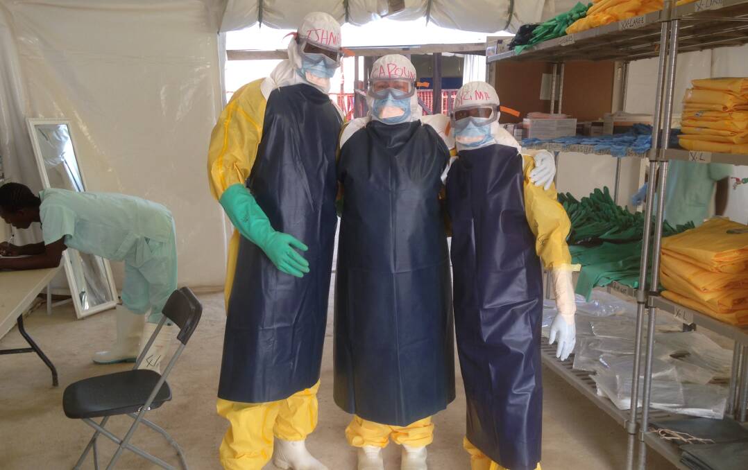 Caroline Nash, centre, in her personal protective equipment gear ready to enter the ebola treatment centre "red zone". 