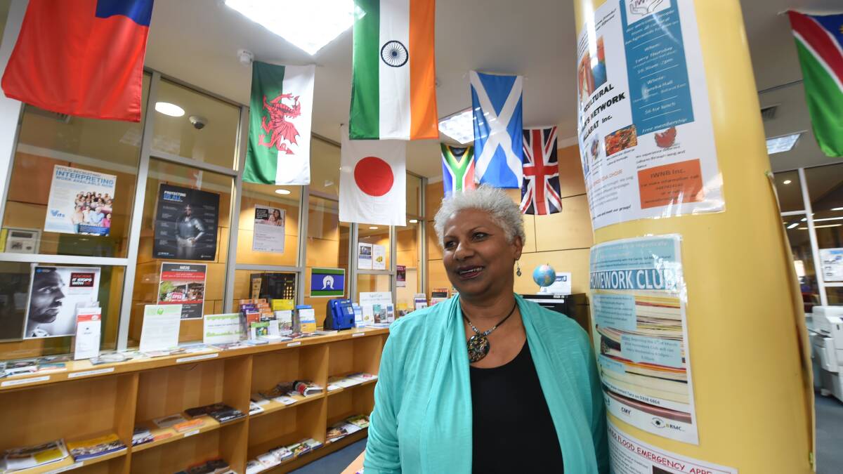 Volunteer Francina Grace helps staff the Multicultural Information Place Desk at the Ballarat Library. PICTURE: Lachlan Bence 