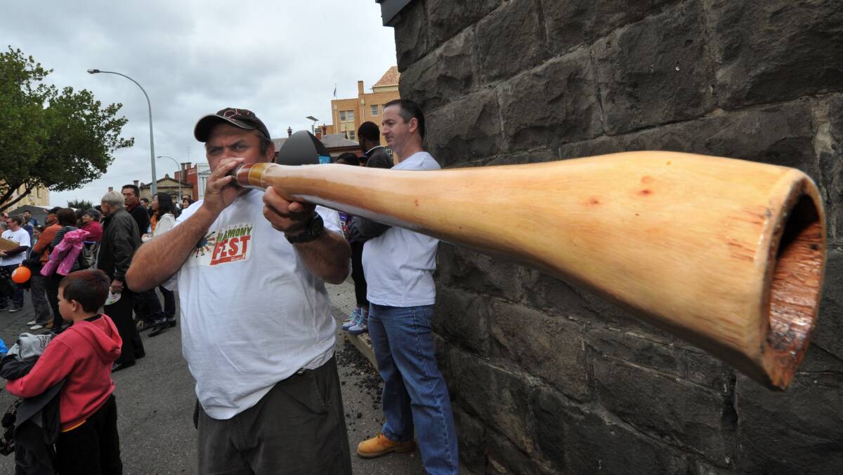 Tony Lovett plays a didgeridoo during Harmony Fest in Camp Street. PICTURE: Jeremy Bannister 