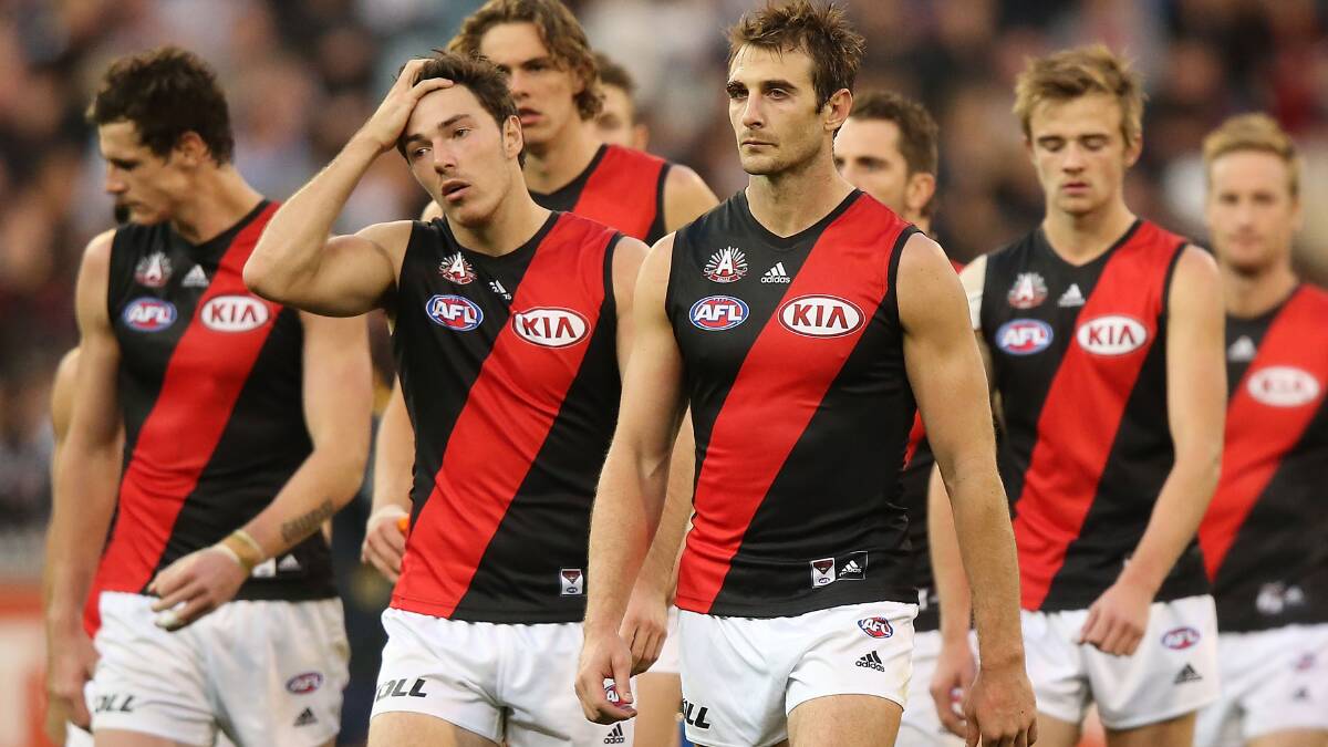 Jobe Watson of the Bombers leads the team off after their defeat. Photo: Getty Images. 