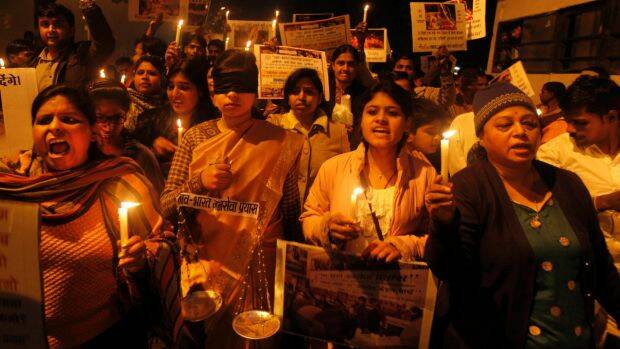Indians take part in a candlelight vigil for a victim of gang rape in New Delhi, India, January 13, 2013. .  Photo: AP
