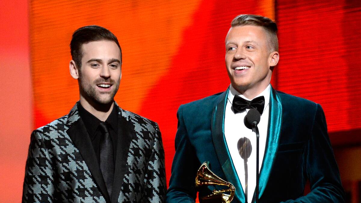 Rappers Ryan Lewis (L) and Macklemore accept the Best New Artist award onstage during the 56th GRAMMY Awards at Staples Center on January 26, 2014 in Los Angeles, California. Photo: GETTY IMAGES