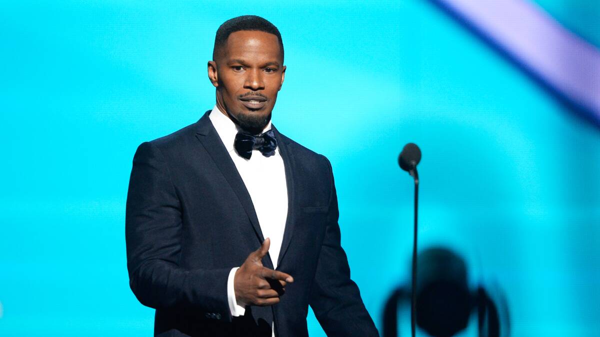 Actor Jamie Foxx introduces the nominees for Best Rap/Sung Collaboration on stage during the 56th GRAMMY Awards at Staples Center on January 26, 2014 in Los Angeles, California. Photo: GETTY IMAGES