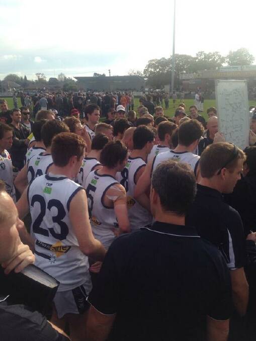The Ballarat Football League huddle searches for answers at Shepparton.