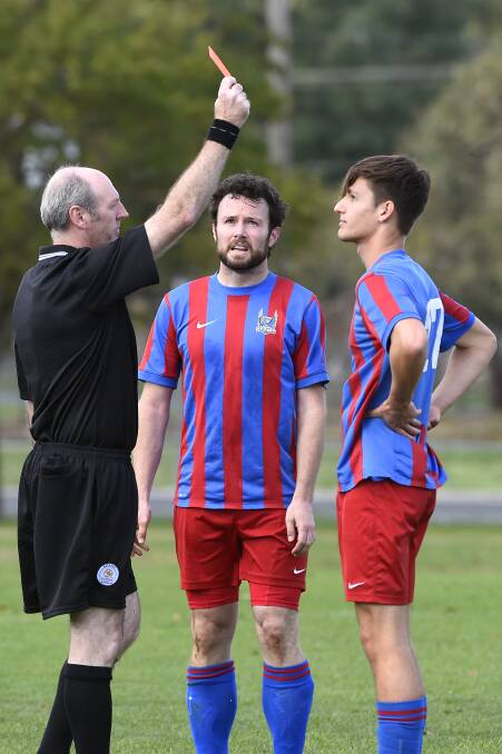 BDSA  division 1 - North United v Vic Park: Ben Lembo (Vic Park) is shown a red card while teammate Shane Jones watches on. Photo: Justin Whitelock
