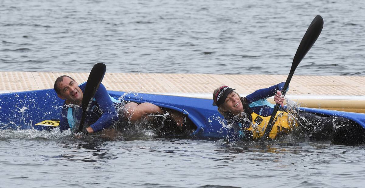 David Little and Pauline Findlay capsize on day two of the Australian Canoe Marathon Championships at Lake Wendouree.