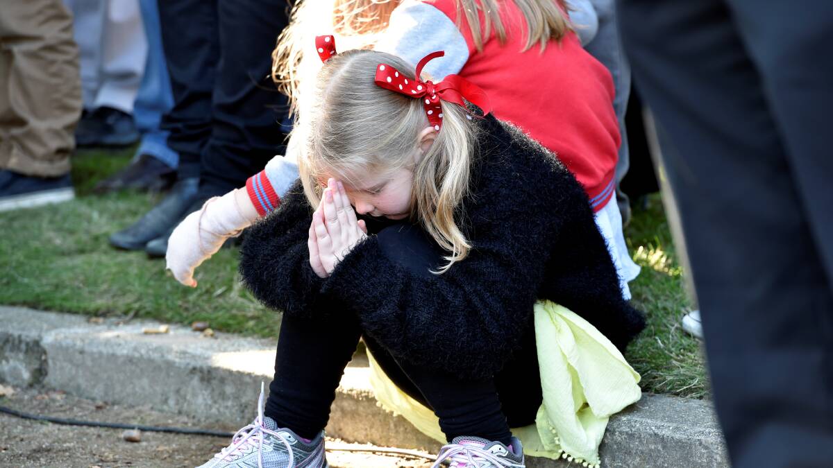 Penelope Stephen prays during the prayers. PICTURE: JEREMY BANNISTER