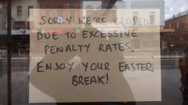 Two prominent local businessmen claimed they could not afford to pay their staff exorbitant wages over Easter. This sign was in the window of The Forge Pizzeria. PICTURE: JAMES RAYNES