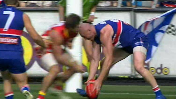 Campbell Brown goes head to head in a big clash with Western Bulldogs hard man Barry Hall. He was suspended for two weeks after this.