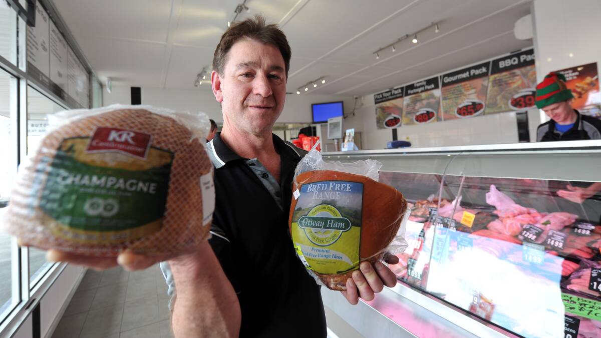 Barry Flower with some of his hams. PICTURE: LACHLAN BENCE