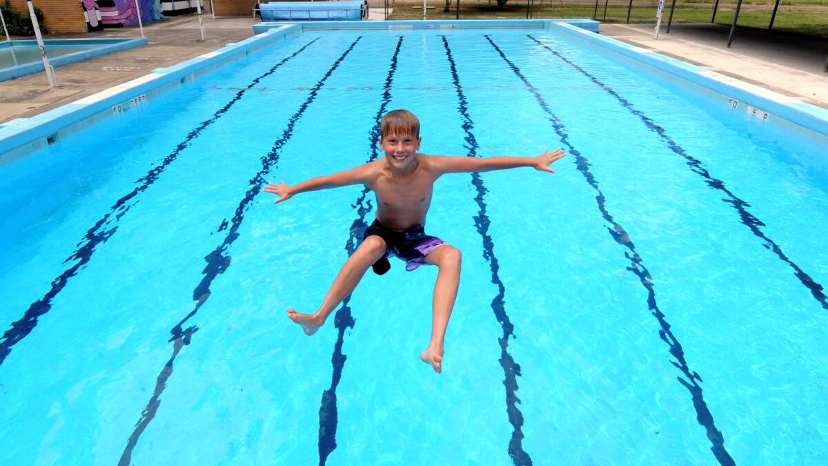 Jordan Learmount enjoying the Black Hill pool in 2012. PICTURE: LACHLAN BENCE
