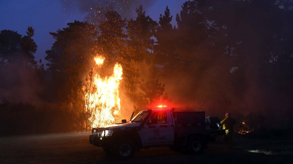 Firefighters battle the blaze.