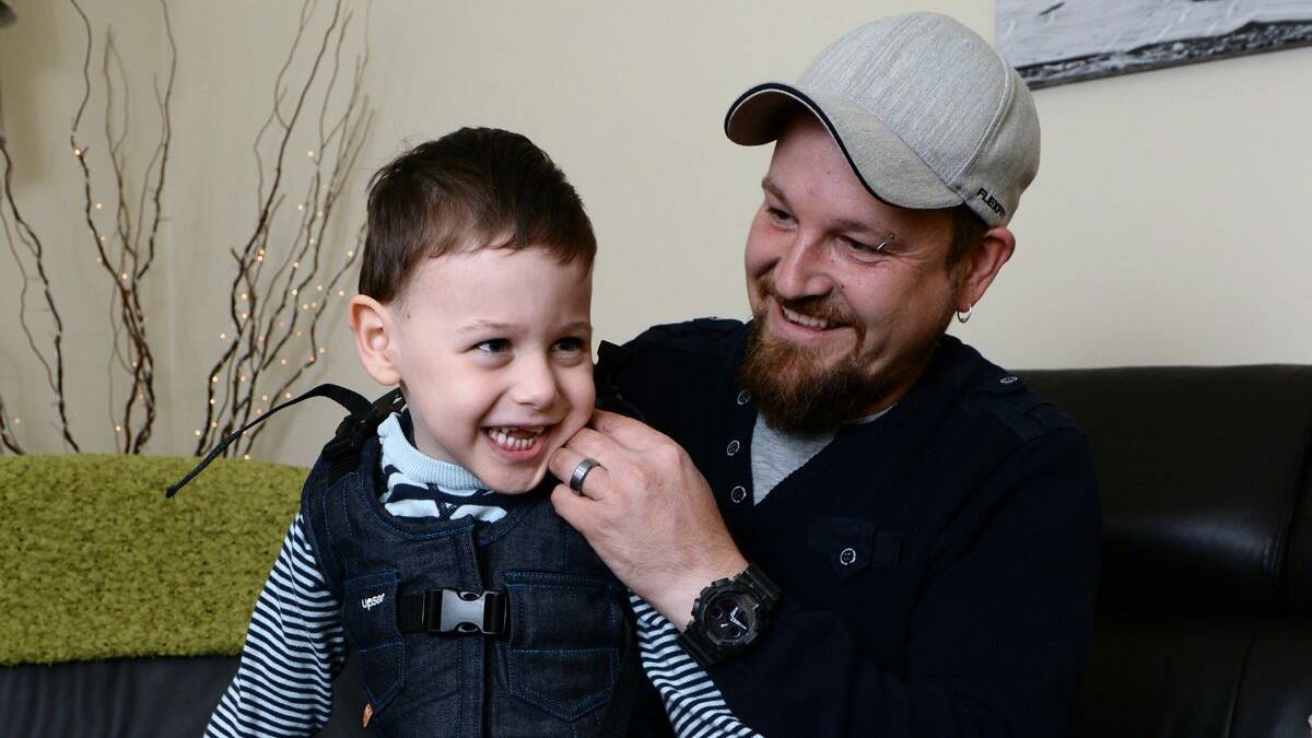 Mobile: Bohdi, 4, with his dad, Keenan Pilat. PICTURE: KATE HEALY