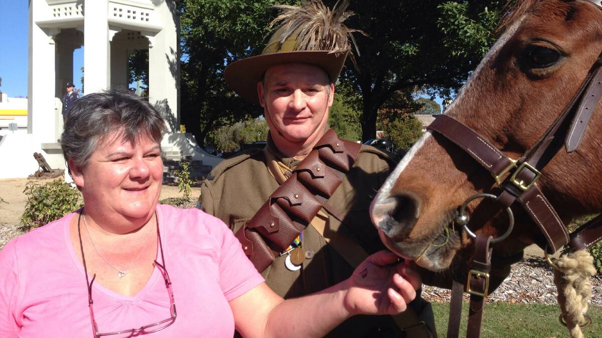 Rodney and Kaye Hall at the Anzac Day service at Beaufort, with Zoe the horse. PICTURE: TOM COWIE