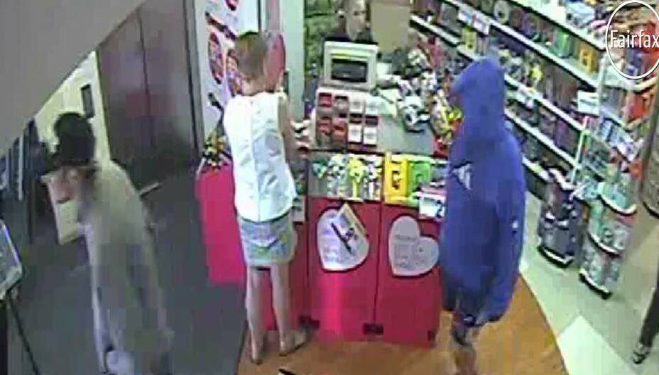 The two men scout the store before robbing it minutes later. PICTURE: CCTV