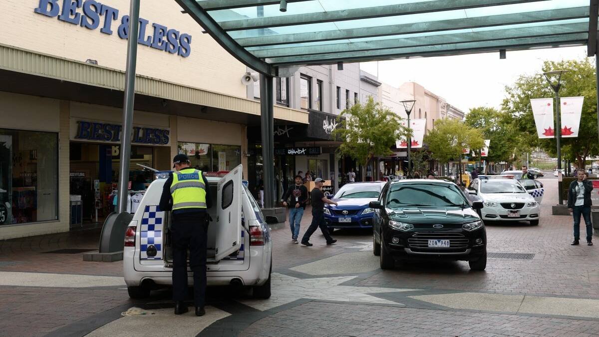 Police officers in the Bridge Mall near the scene of a knife attack this afternoon. PICTURE: ADAM TRAFFORD