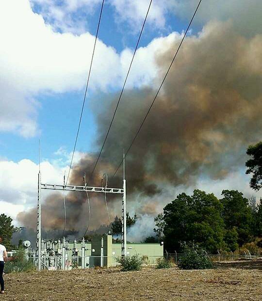 A great shot of the fire behind some electricty infrastructure. Photo: "Mad Nook" Johnston