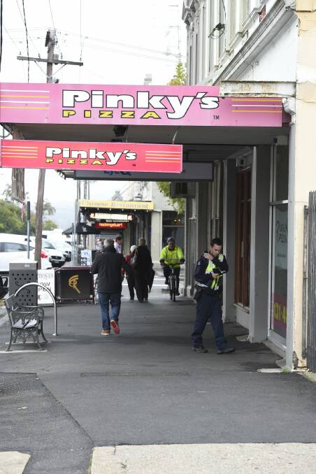 Police search the area for clues following the armed robbery on Tuesday afternoon. PHOTOS: Justin Whitelock
