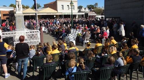 Huge crowds attend the Clunes Anzac Day service. PICTURE: MICHAEL CHESIRE