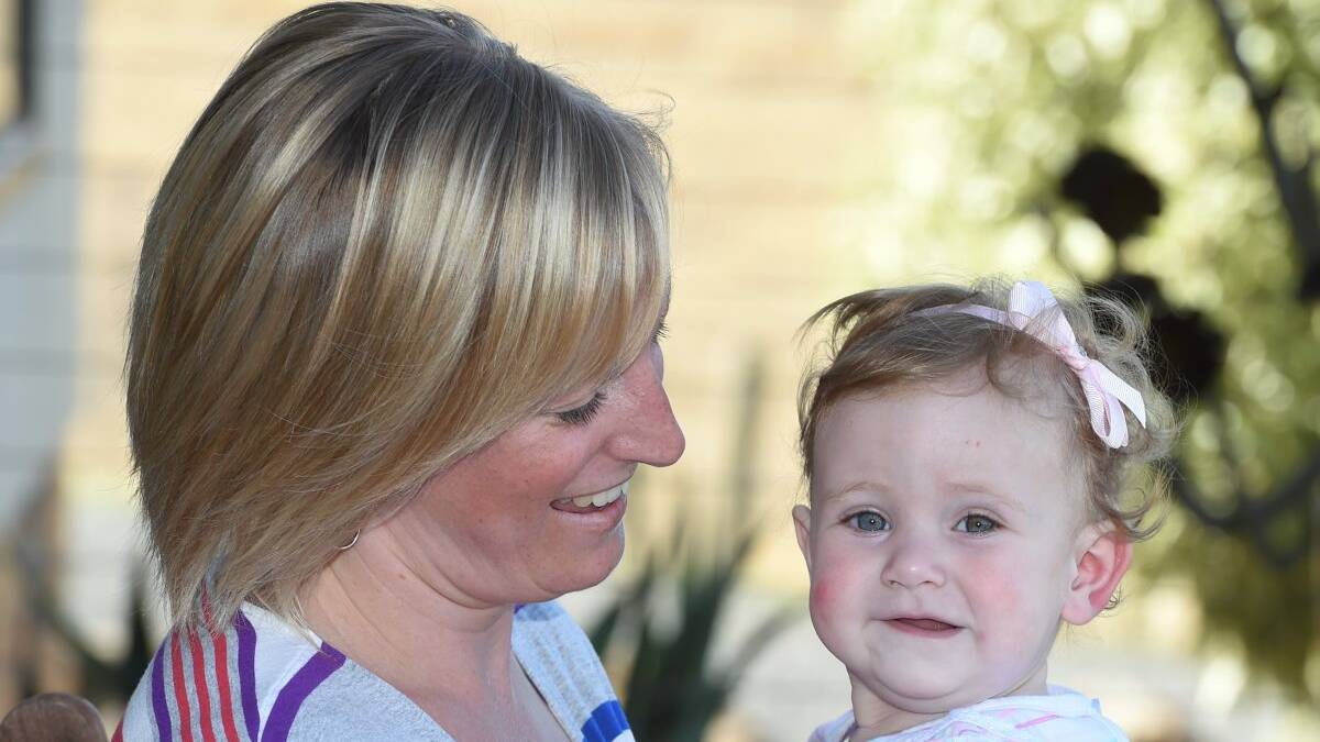 Elly McAuliffe and one year old Grace McAuliffe. Picture and Video: Lachlan Bence