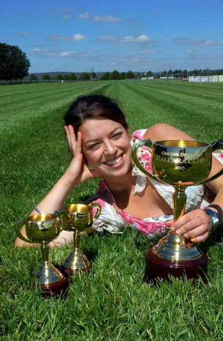Ellen Garland with the Ballarat Cup and winning Jockey and Trainer's cups at Dowling Forest.