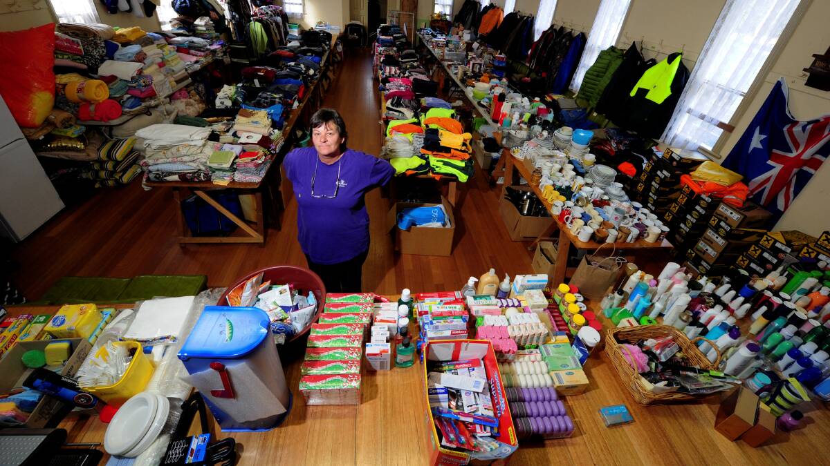 Dereel resident and personal donations co-ordinator Julie Donaghy in the town's community centre during 2013, which became a distribution depot following the fires.