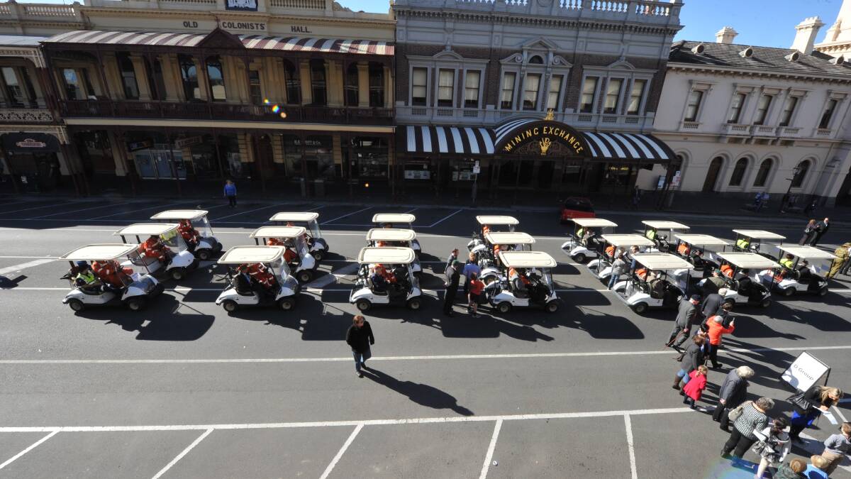 SES members prepare to escort veterans in golf buggies in the 2014 Anzac Day march. PICTURE: JEREMY BANNISTER