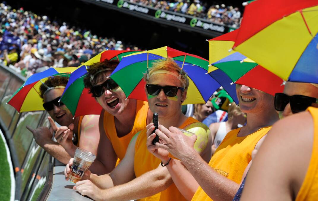 While umbrellas are banned from the 'G due to a safety regulation - umbrella hats however are another matter.
