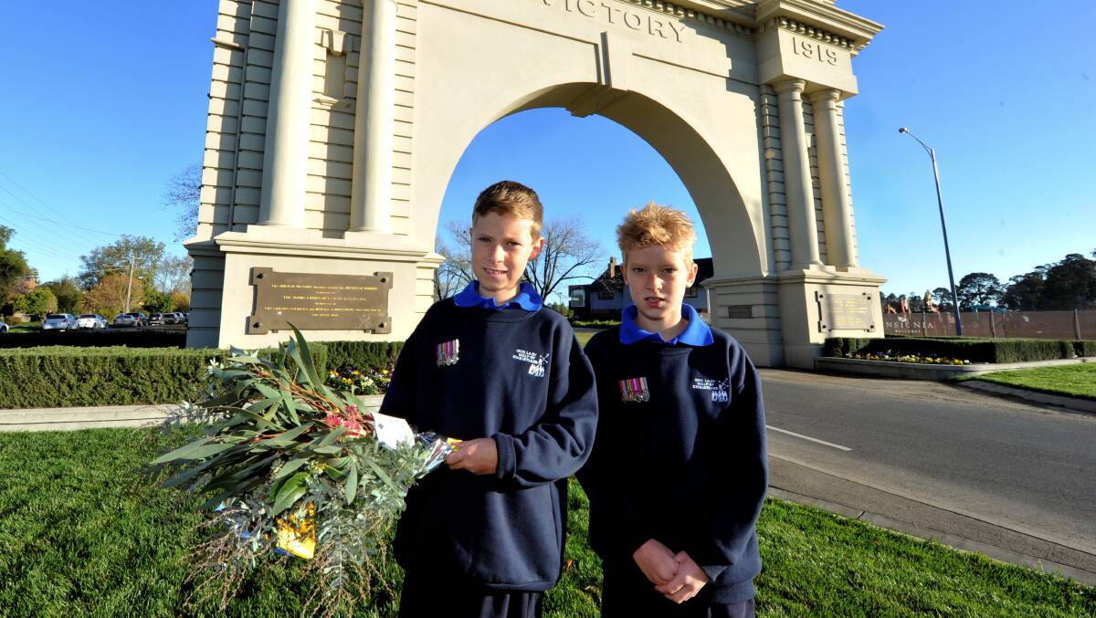 Riley and Declan Kenny laid a wreath for Our Lady Help of Christian PS. PICTURE: JEREMY BANNISTER