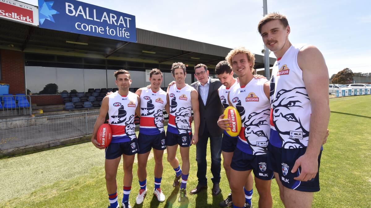 Western Bulldogs players with Daniel Andrews at Eureka Stadium on Thursday. PICTURE: JEREMY BANNISTER