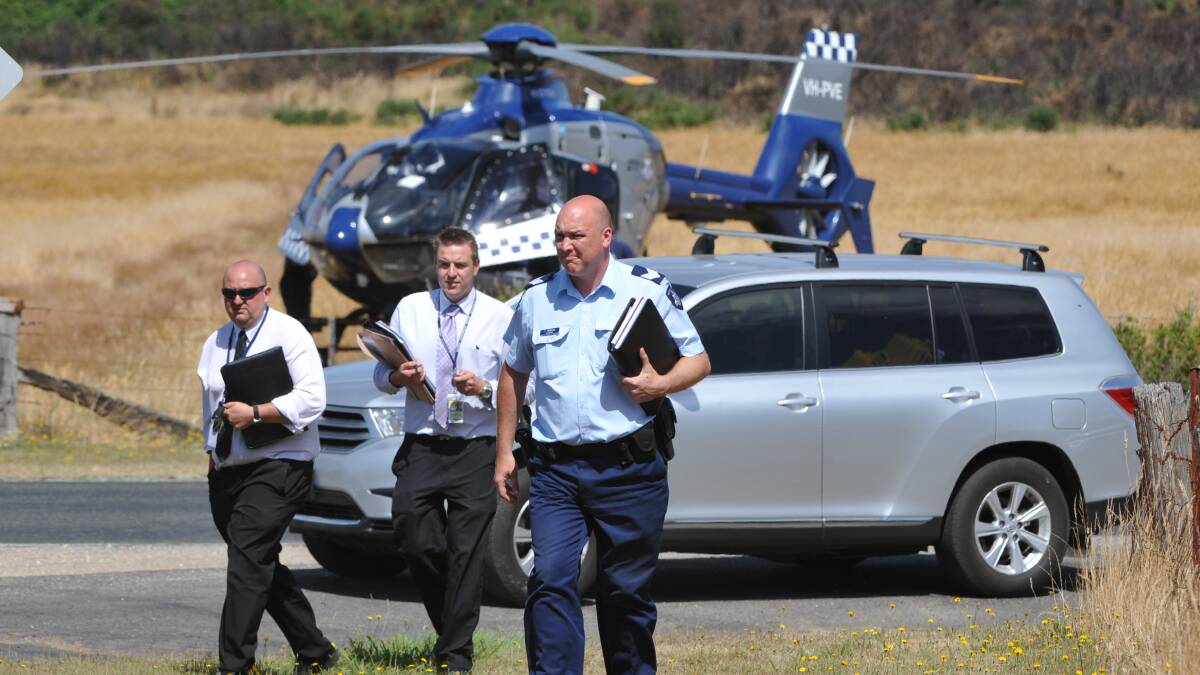 Police arrive at the murder scene. PICTURE: KATE HEALY