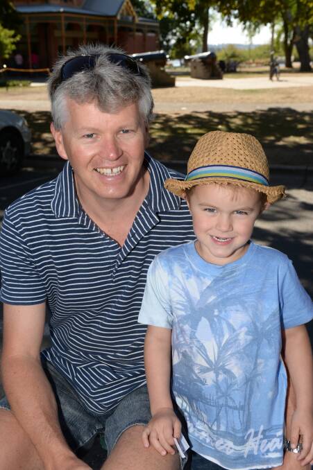 Danny Moore and Jesse Moore, 4, of Mt Rowan at the Begonia Festival parade.