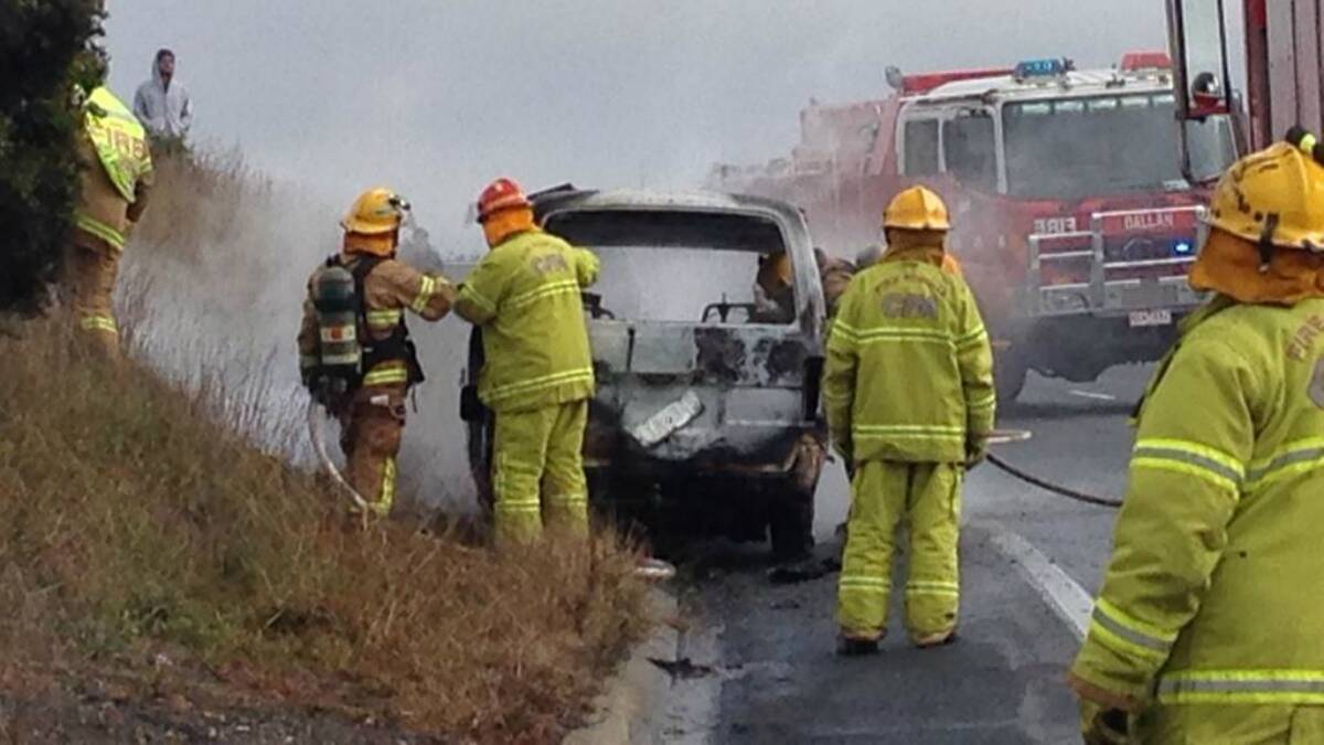 Fire crews extinguishing the car fire on the Western Freeway on Saturday morning. PICTURE: ASHLYNNE MCGHEE / TWITTER