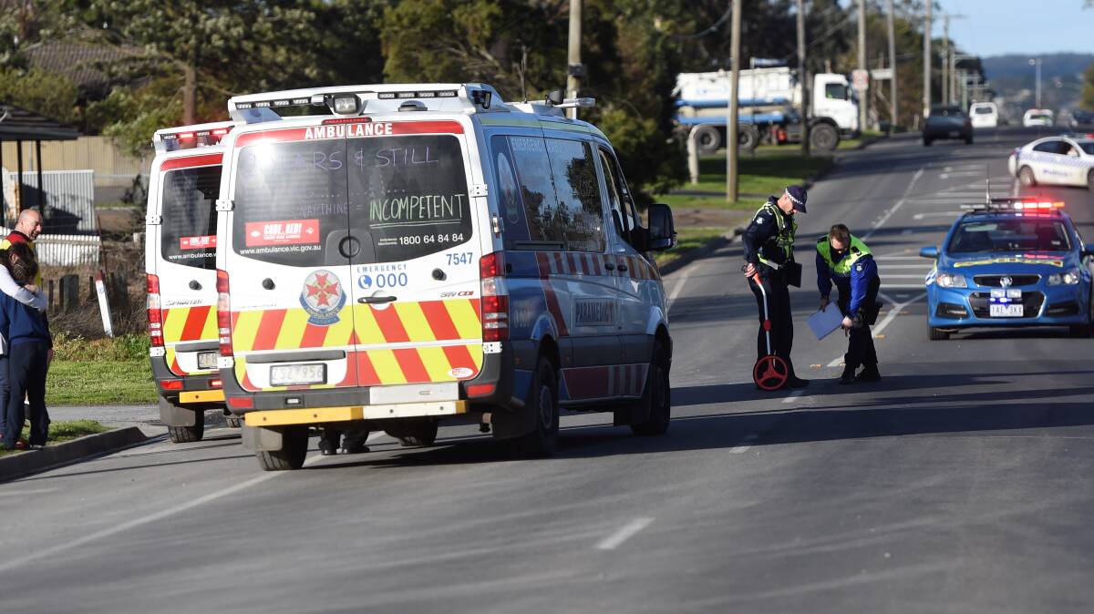 Police and ambulance workers at the scene of a child hit by a vehicle at Delacombe. PICTURE: LACHLAN BENCE