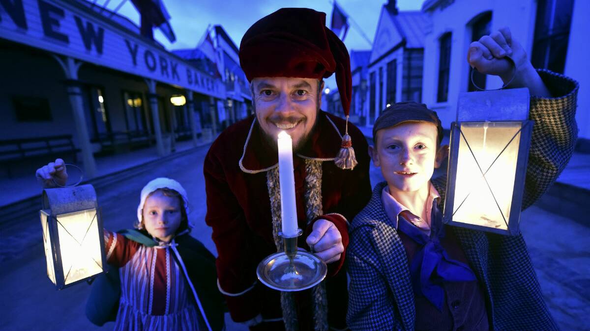 Saint Nicholas (Jarrod Page) with Tess and Max Filmer at Sovereign Hill ahead of its Christmas in July program. PICTURE: JEREMY BANNISTER