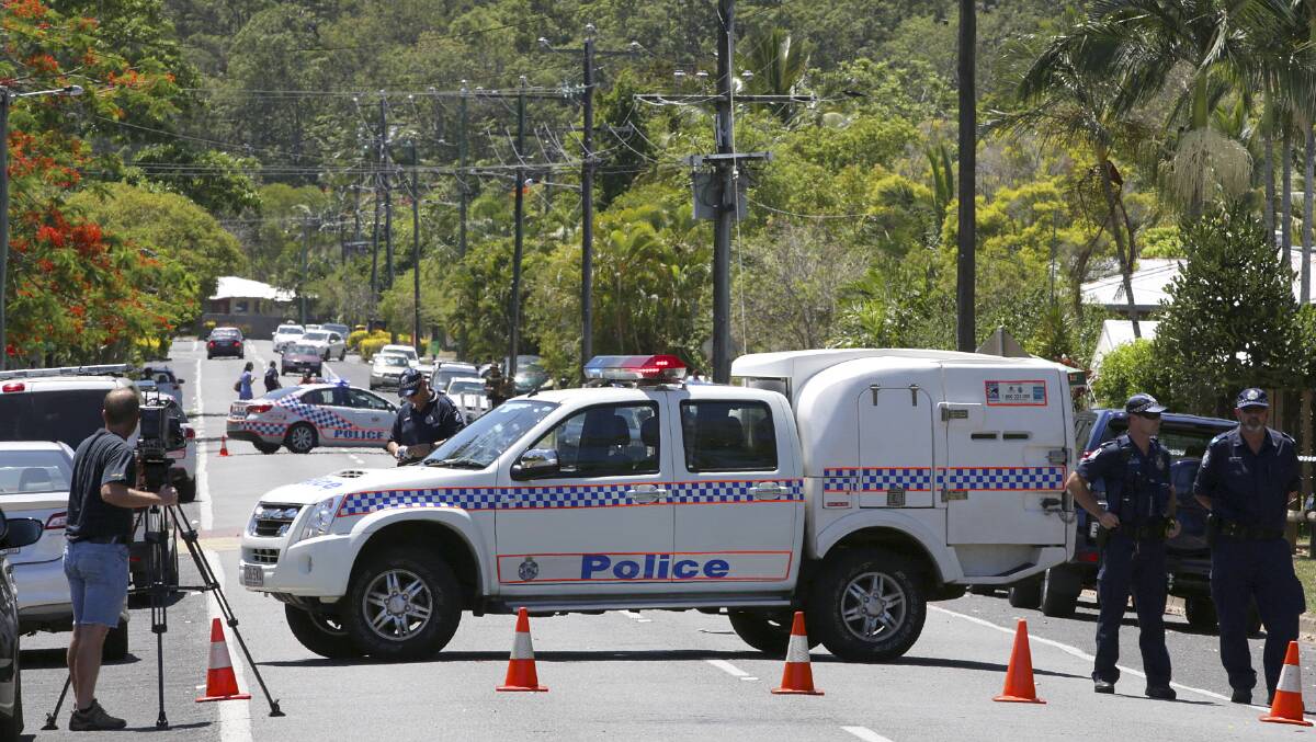 Police at the scene of the Cairns stabbing where eight children were killed. The mother of seven of the children has been arrested this morning.