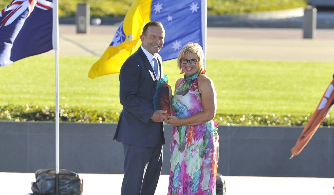 Prime Minister Tony Abbott with 2015 Australian of the Year, Rosie Batty.