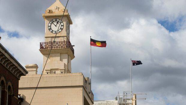 Flags flying over Richmond Town Hall, where Yarra Council took its controversial vote.  Photo: Paul Jeffers
