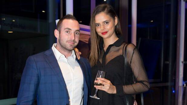 Luke Hunt and Samantha Harris at Sunglass Hut's annual summer party at The Calyx in the Royal Botanic Garden on Wednesday. Photo: Wendell Teodoro
