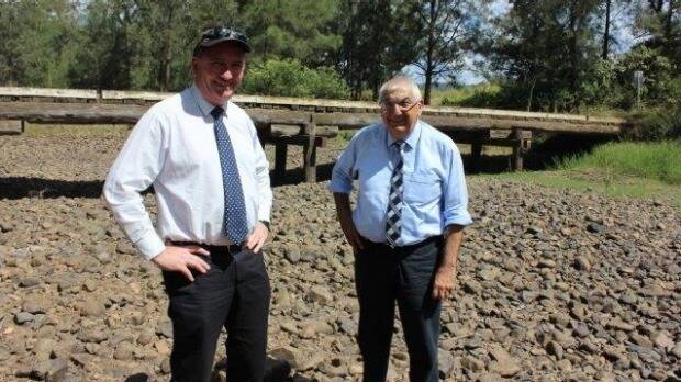 Deputy Prime Minister Barnaby Joyce inspected a bridge with state MP Thomas George following the helicopter flight to Drake. Photo: Supplied