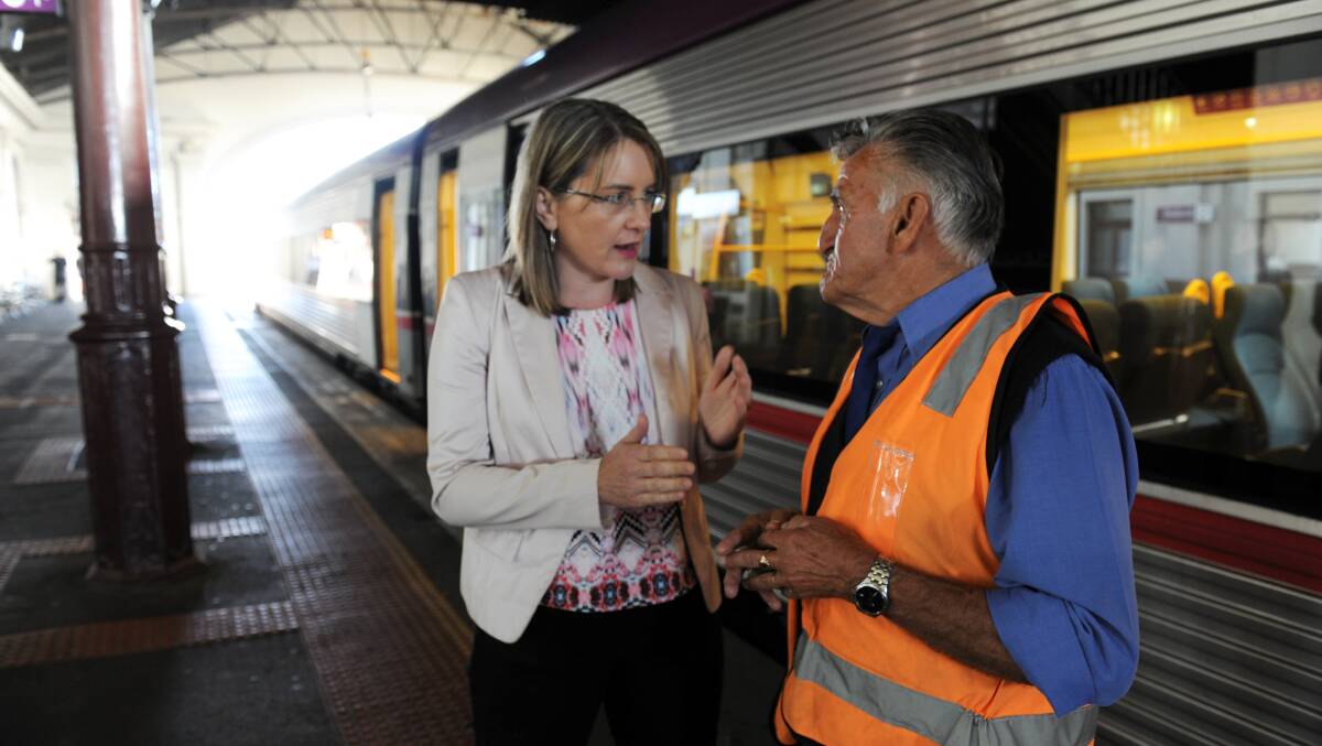 Transport Minister Jacinta Allan congratulates Bill Stevens on Tuesday in Ballarat. PICTURE: LACHLAN BENCE 