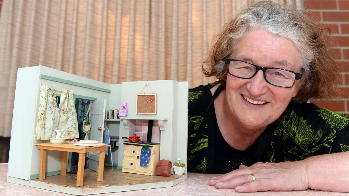 Gwen Jarvis with her miniature kitchen at the Dolls House and Miniatures Fair. PICTURE: KATE HEALY