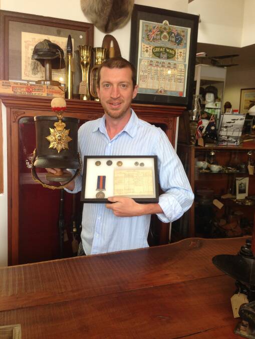 Ben Smith with the original shako with plate and document signed by Captain Wise, who was killed at the Eureka Stockade.