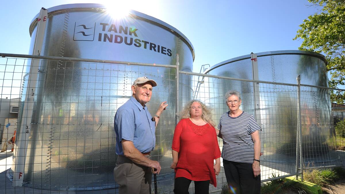 Alan Morrison, Clare Griffin and Fiona Ludbrook are upset at the position of two giant water tanks at the Kelaston aged care home redevelopment. PICTURE: JUSTIN WHITELOCK