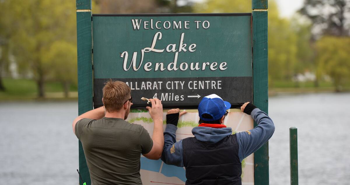  The Doctor Blake Mysteries crew fixes a prop sign on Lake Wendouree. Picture: Adam Trafford