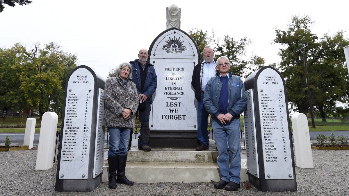 Pat Yeoman, Joseph Sensi, Les Finch and Leo Brown at the restored war memorial in Snake Valley. PICTURE: JUSTIN WHITELOCK