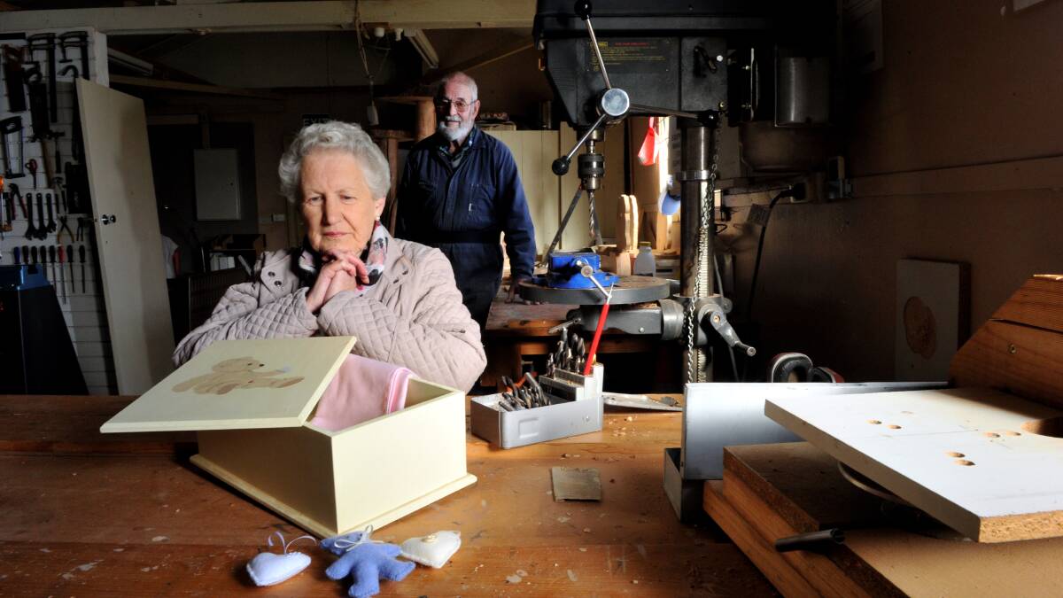 “Memory” boxes are coffins made for miscarriages and cot deaths. Needle worker Valmai Hearn and Brian Rickard, from the Ballarat Woodworkers Guild, have combined with other volunteers to produce about 160 boxes a year. PICTURE: JEREMY BANNISTER
